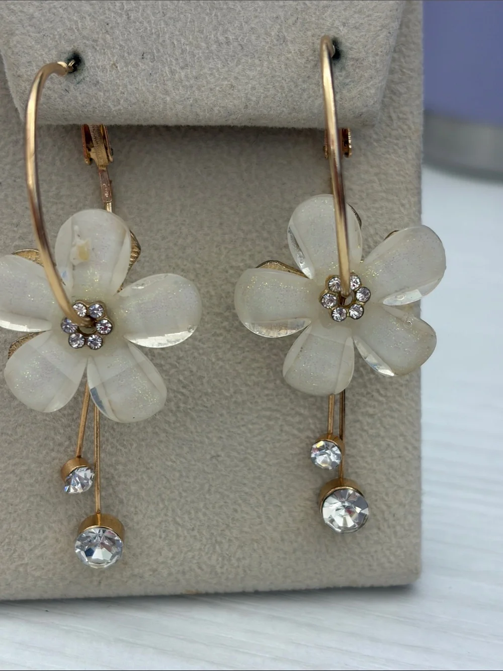 Gold Hoop Earrings with White Flower Drops and Crystal Accents